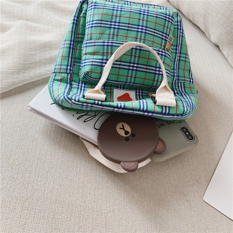 Vattentålig ryggsäck för barn – slitstark canvas, rutmönster och smart förvaring